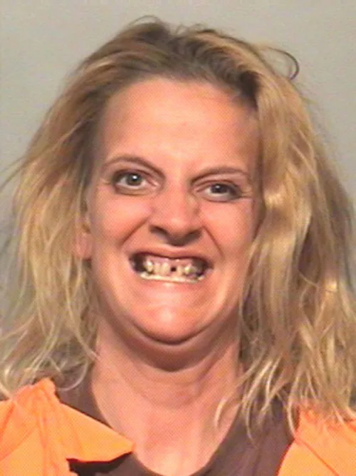 Funny-Mug-Shots-Woman-Teeth.webp
