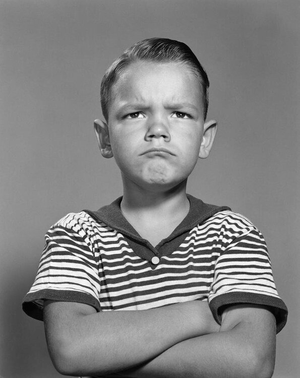 angry-boy-with-arms-folded-c1960s-h-armstrong-robertsclassicstock.jpg